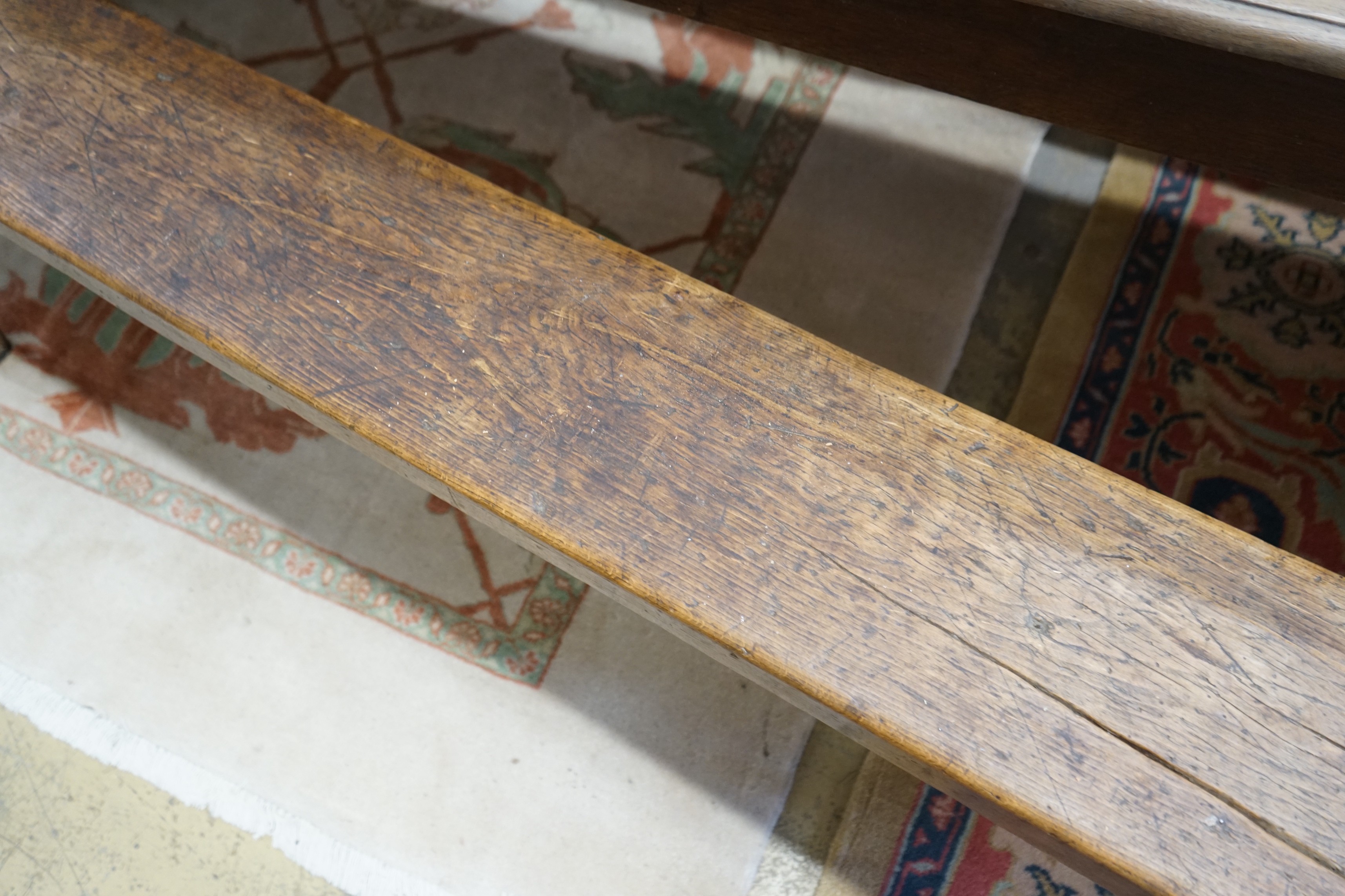 A pair of 19th century provincial elm and beech bench seats, length 199cm, depth 23cm, height 48cm